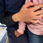 close up of nurse listening to child's lungs with a stethoscope 