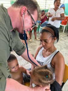 Doctor examining a small child