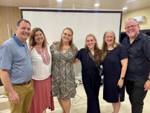 Group of speakers and translators standing together in church